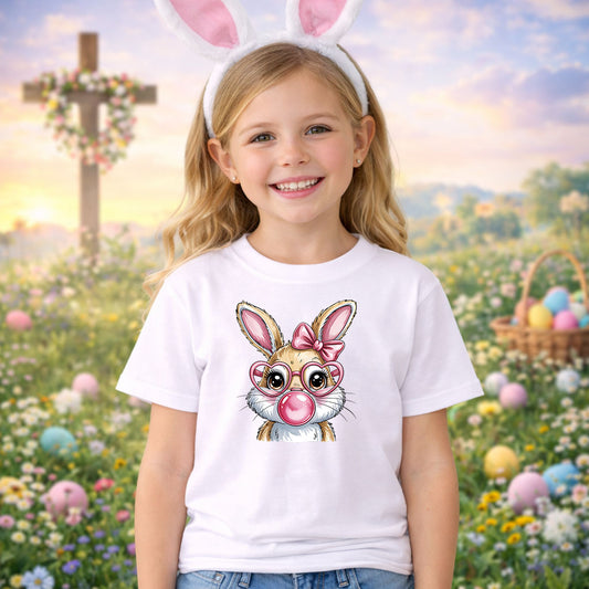 Easter Bunny Glam DTF transfer design mockup on a t-shirt featuring a cartoon bunny with pink heart-shaped glasses, a pink bow and pink bubble gum