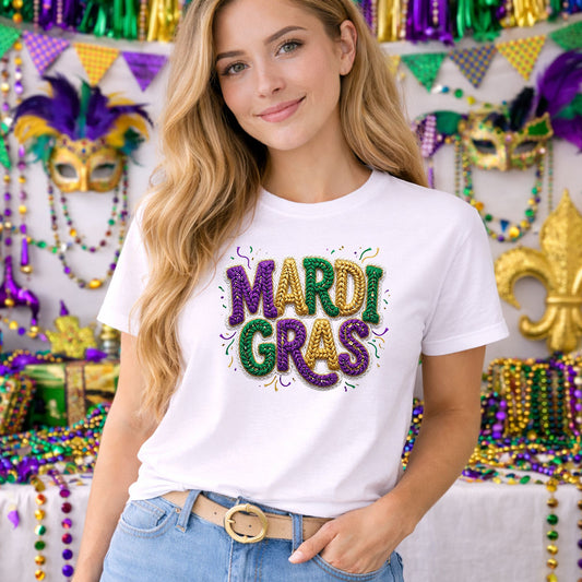 Faux Yarn Mardi Gras DTF transfer design mockup on a t-shirt featuring MARDI GRAS lettering in faux yarn crochet texture in purple green and gold
