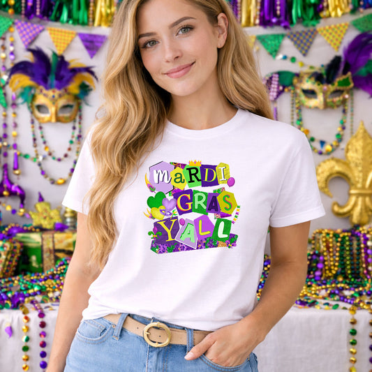 Mardi Gras Y'all DTF transfer design mockup on a t-shirt featuring playful multicolor cut-out MARDI GRAS Y'ALL lettering with Mardi Gras accents