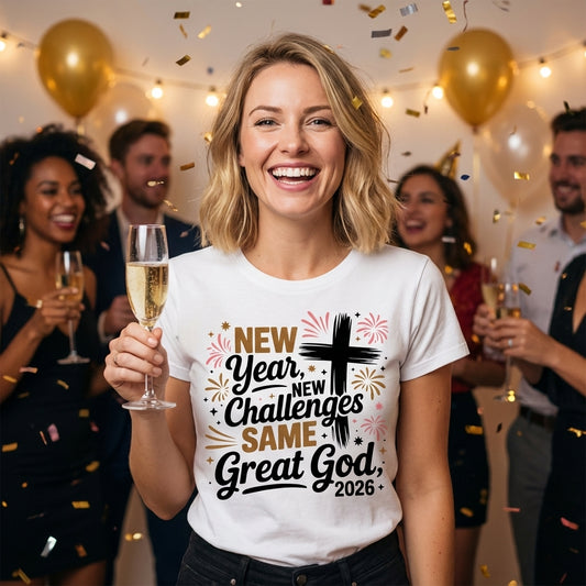 New Year New Challenges Same Great God 2026 DTF transfer design mockup on a white t-shirt featuring a black cross with gold and pink firework accents