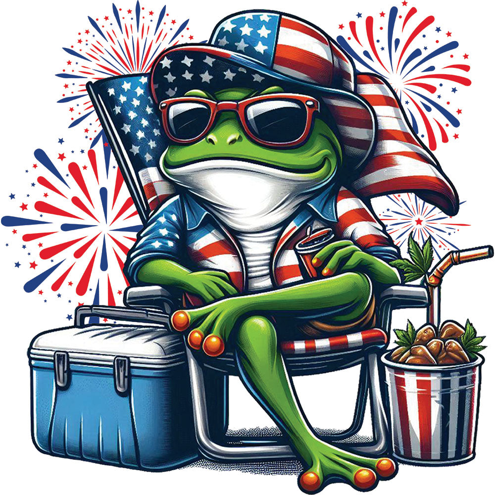 Patriotic Frog DTF transfer design featuring a green frog in a stars-and-stripes hat and sunglasses sitting on a beach chair with a USA cooler and popcorn under fireworks
