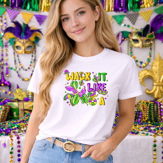 Walk It Like A Dog DTF transfer design mockup on a t-shirt featuring a Mardi Gras balloon-animal dog in green purple and gold balloons with Walk It Like A typography