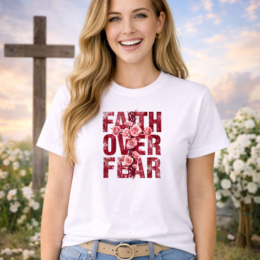 Faith Over Fear Red Flowers DTF transfer design mockup on a t-shirt featuring bold FAITH OVER FEAR distressed typography accented with a vine of red roses