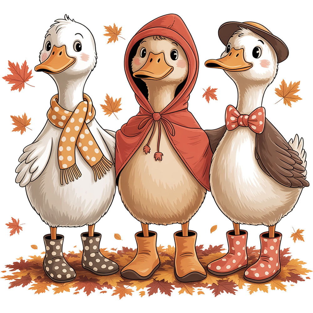 Fall Cozy Gooses DTF transfer design featuring three cartoon geese in fall outfits with scarf, red hooded cape and brown hat with bowtie wearing rain boots in autumn leaves