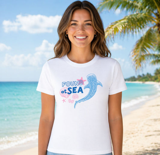 Found At Sea Whale DTF transfer mockup on a t-shirt featuring a blue whale shark with shells, starfish, and a bow