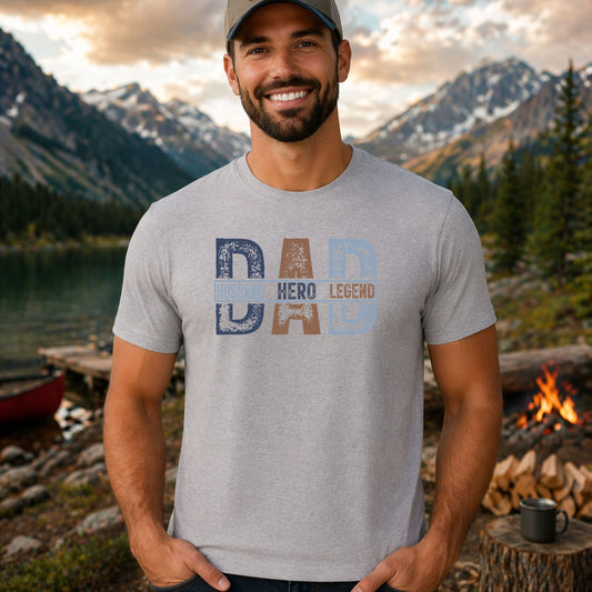 Husband Hero Legend DTF transfer design mockup on a t-shirt featuring bold distressed DAD lettering with HUSBAND HERO LEGEND title ribbons across the letters