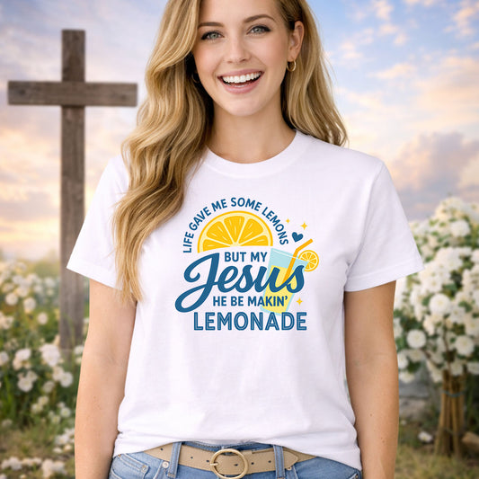 Jesus Makin Lemonade DTF transfer design mockup on a pink t-shirt featuring a lemon slice, lemonade glass and Life Gave Me Some Lemons But My Jesus He Be Makin Lemonade text