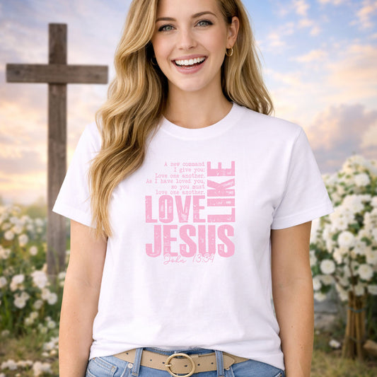 Love Like Jesus Pink DTF transfer design mockup on a pink t-shirt featuring stacked LOVE LIKE JESUS letters with John 13:34 verse