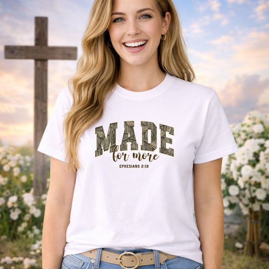 Made For More Camo DTF transfer design mockup on a pink t-shirt featuring woodgrain camo MADE letters with for more script and Ephesians 2:10