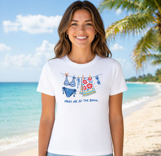 Meet Me At The Beach Bikini DTF transfer design mockup on a t-shirt featuring a clothesline with a striped bikini and a floral towel with Meet Me At The Beach text