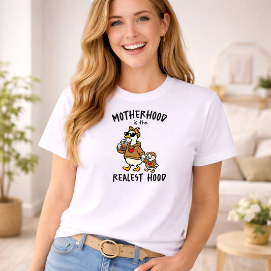 Motherhood Is The Realest Hood DTF transfer design mockup on a t-shirt featuring a mama duck in hoodie with sunglasses and headband walking with a baby duckling in matching hoodie