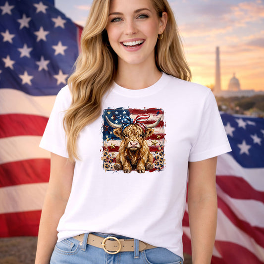 Painted Highland Cow DTF transfer design mockup on a t-shirt featuring a highland cow with red bandana on a painted American flag