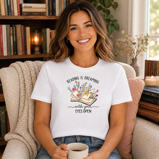 Reading Is Dreaming DTF transfer mockup on a t-shirt featuring an open book with watercolor flowers and an inspirational reading quote
