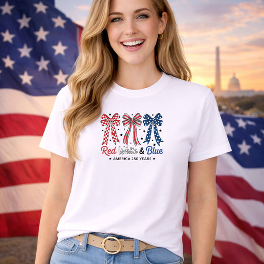 Red White and Blue Bows DTF transfer design mockup on a t-shirt featuring patriotic hair bows in red and blue with America 250 Years tagline