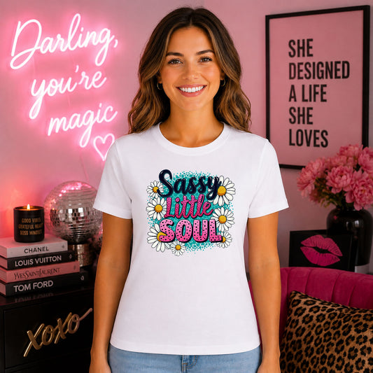 Sassy Little Soul DTF transfer design mockup on a t-shirt featuring Sassy Little Soul colorful script with white daisy flowers on a turquoise splatter background