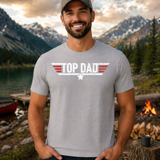 Top Dad DTF transfer mockup on a t-shirt featuring a Top Gun military-style distressed Top Dad emblem with a star and wings