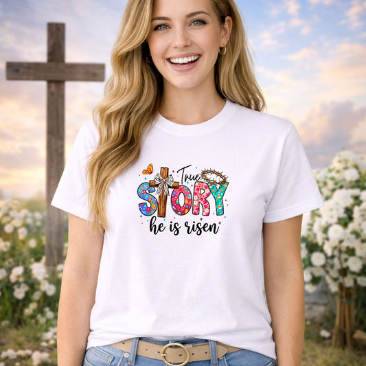 True Story He Is Risen DTF transfer design mockup on a t-shirt featuring a floral cross with cowprint bow and True STORY he is risen typography with butterflies and crown of thorns