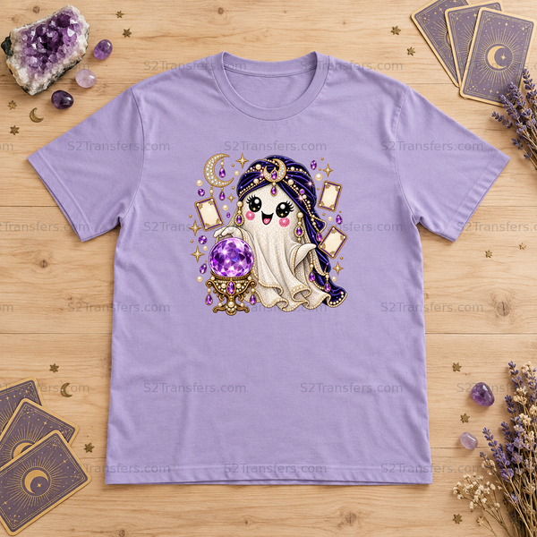 Jeweled fortune teller ghost transfer shown at approximate adult-front size on a lavender T-shirt flatlay. Watermarked mockup; garment not included.